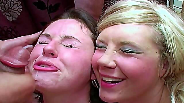 Brunette and blonde having group sex in the living room