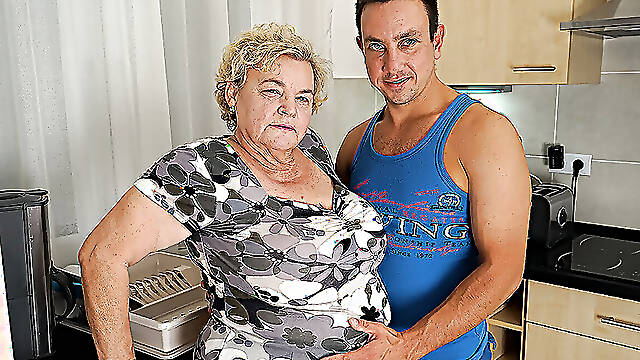 Curvy granny sucking and fucking a way younger dude in her kitchen